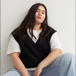 Double-knit sweater vest with a V-neck and ribbing at neckline,armholes and hem.